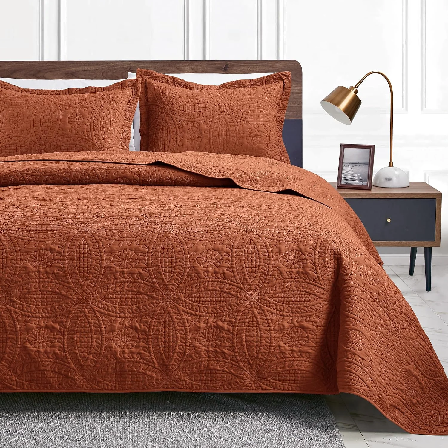 Terracotta coin pattern quilt with matching shams