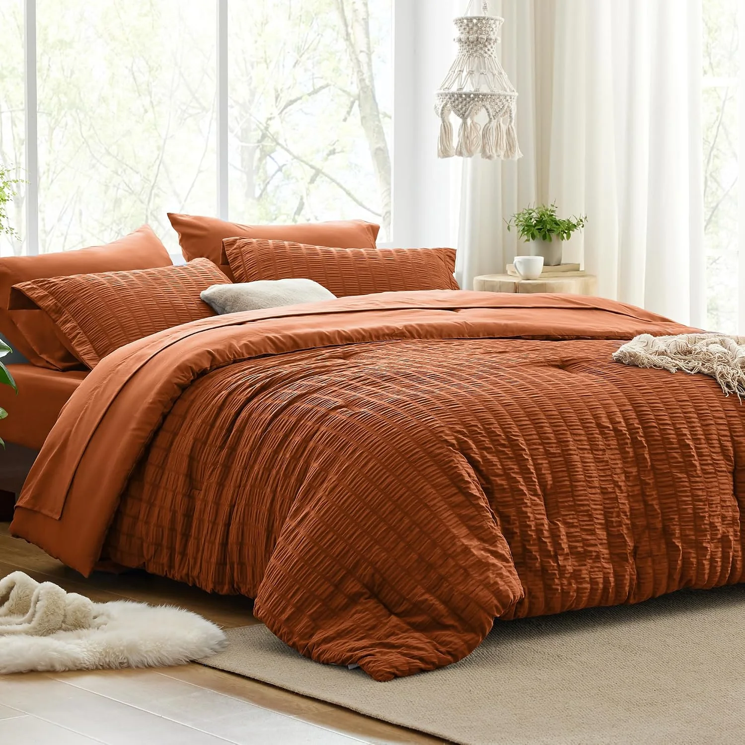 Terracotta seersucker comforter set in a bright bedroom